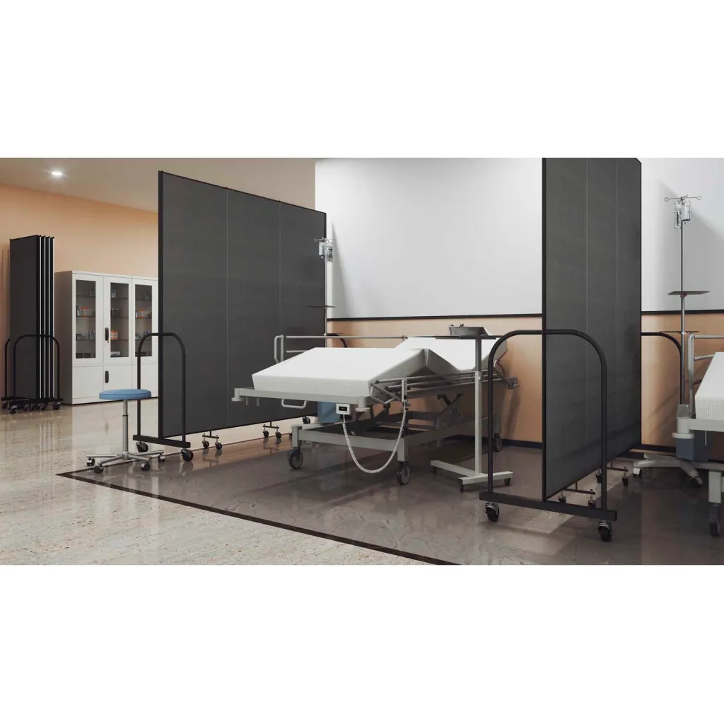 A hospital bed with a black room divider