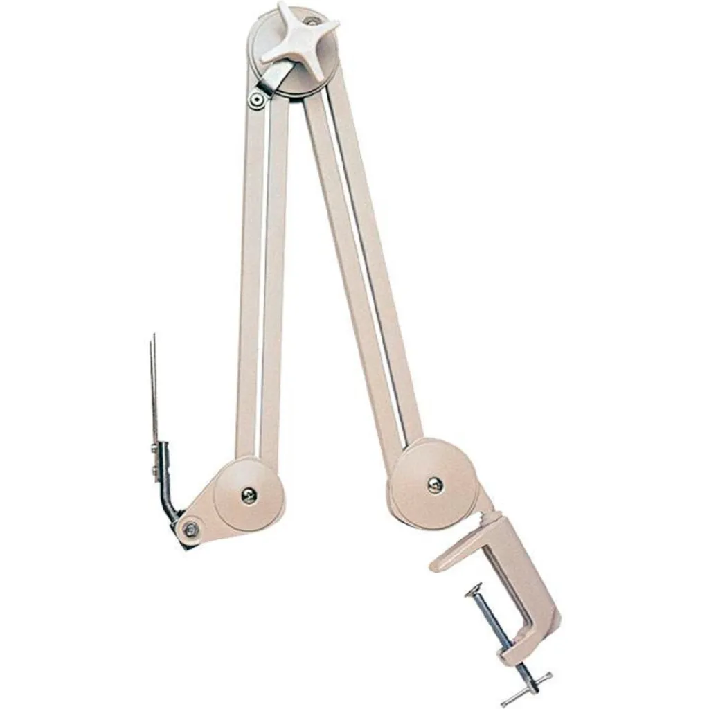 A white adjustable monitor arm with a clamp