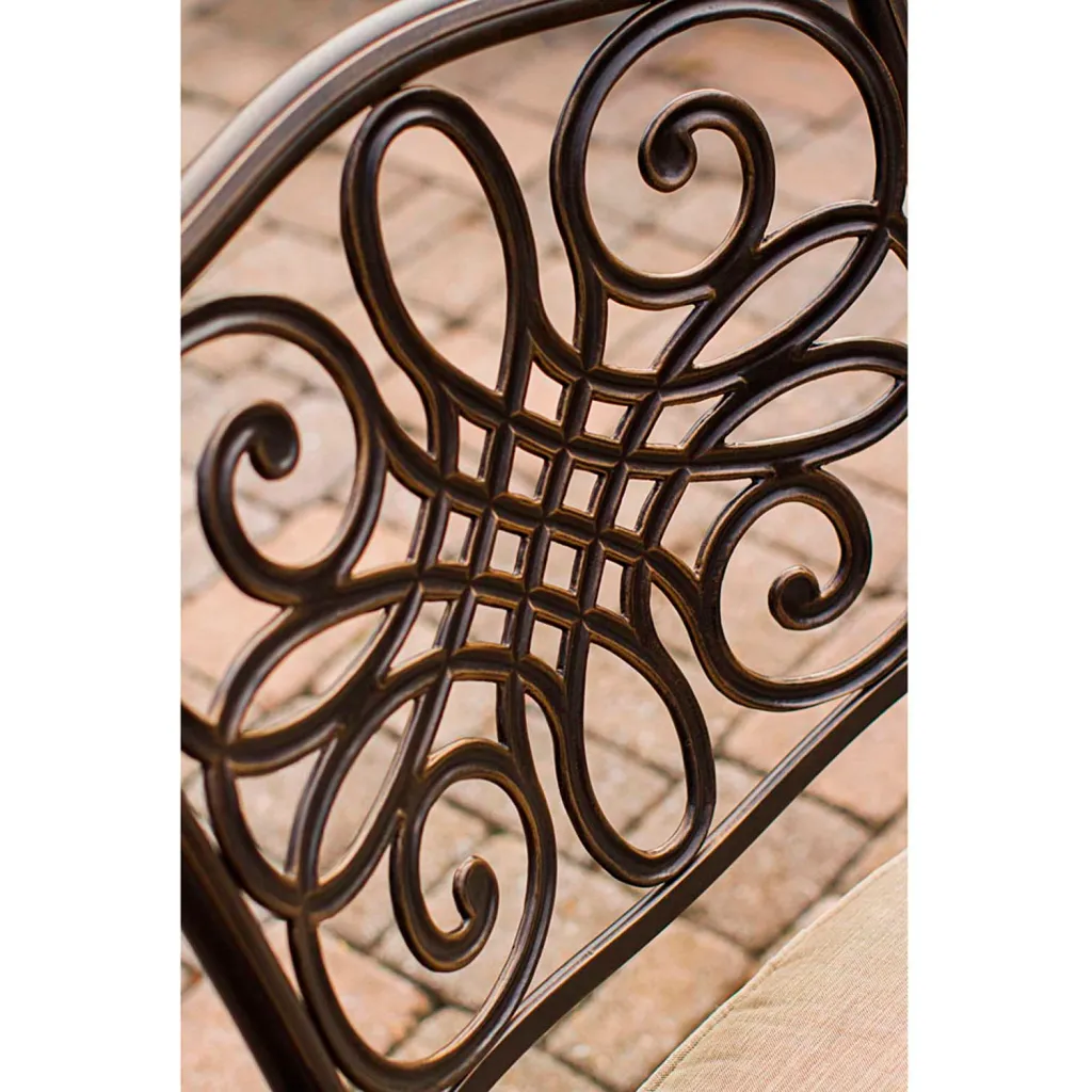 close-up of bronze chair back with ornate design
