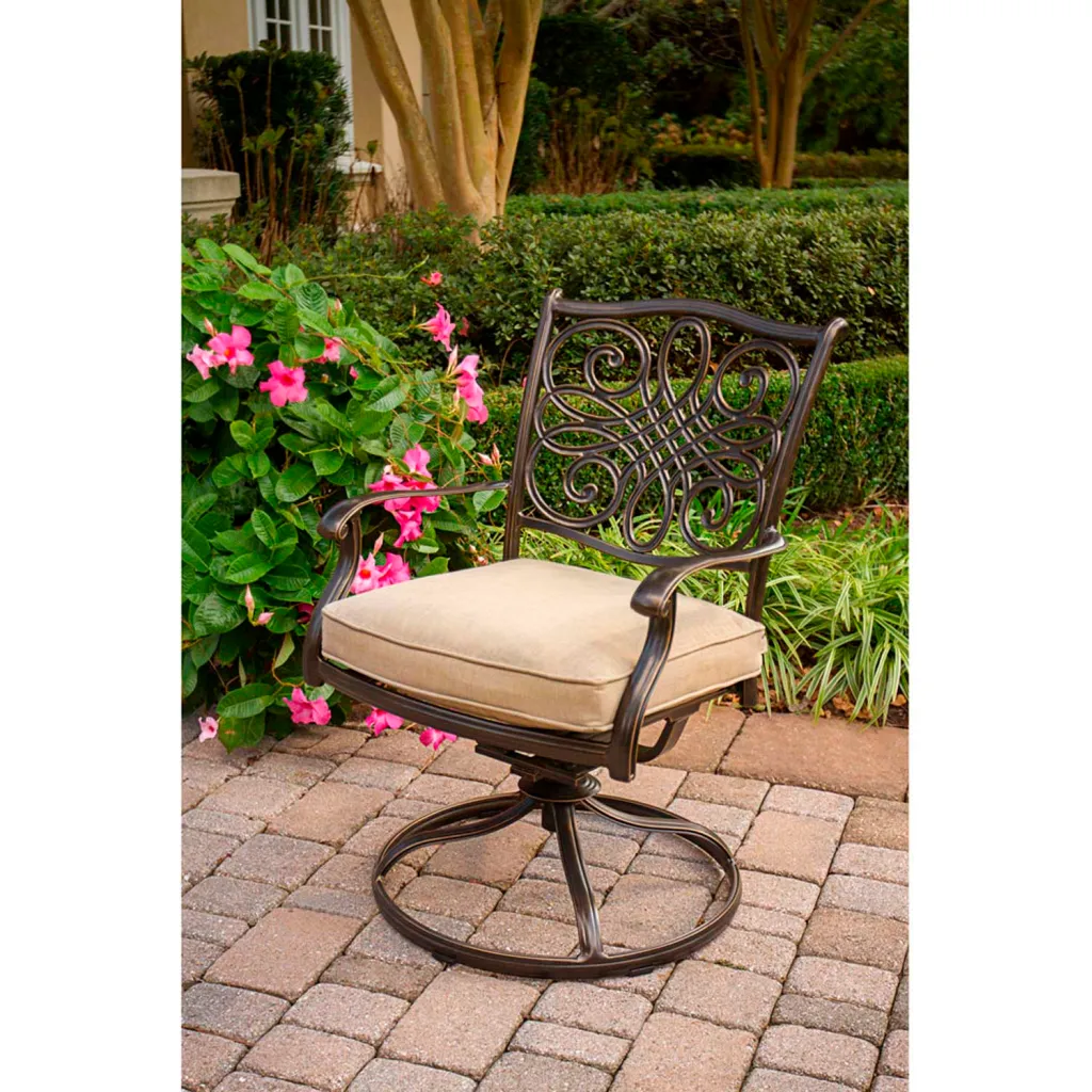 Bronze-finished metal outdoor chair with beige cushion.