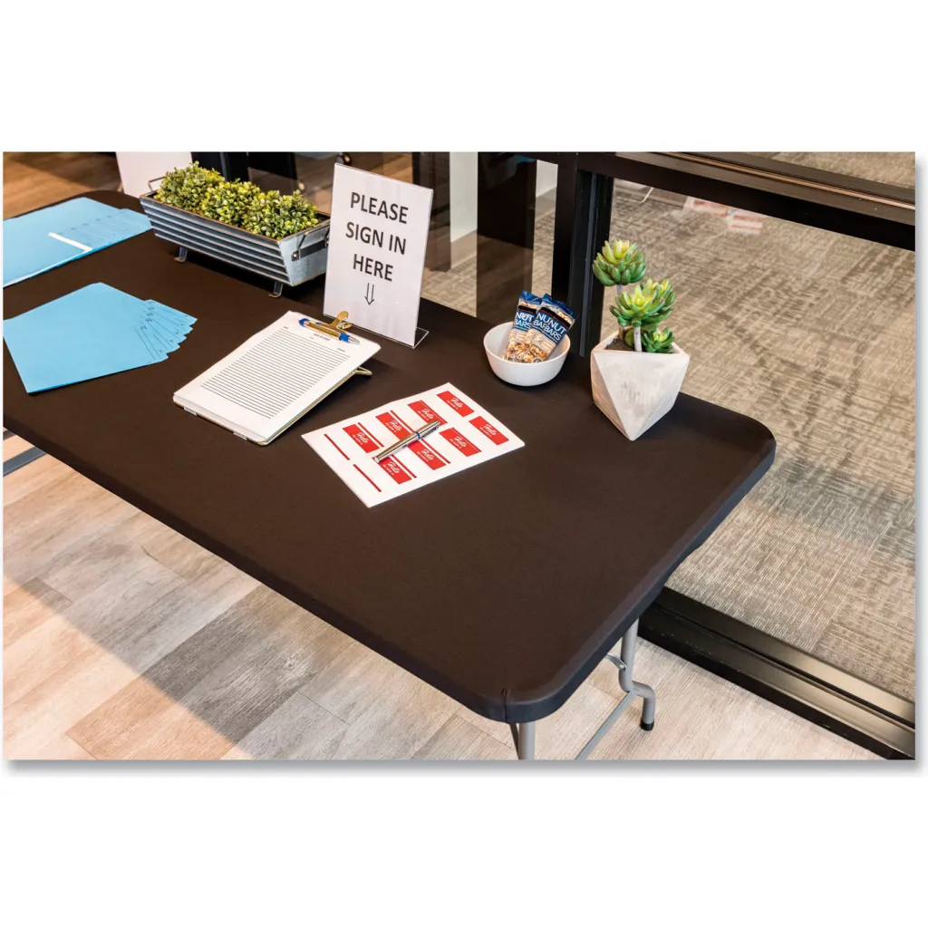 Black folding table with sign-in materials