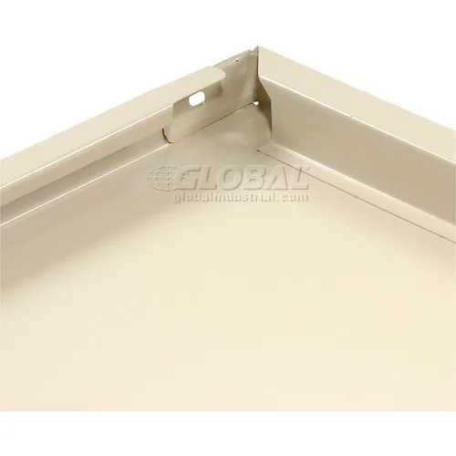 Close-up of beige metal tray corner
