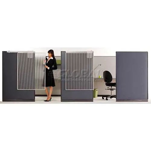 Woman standing in office cubicle setup